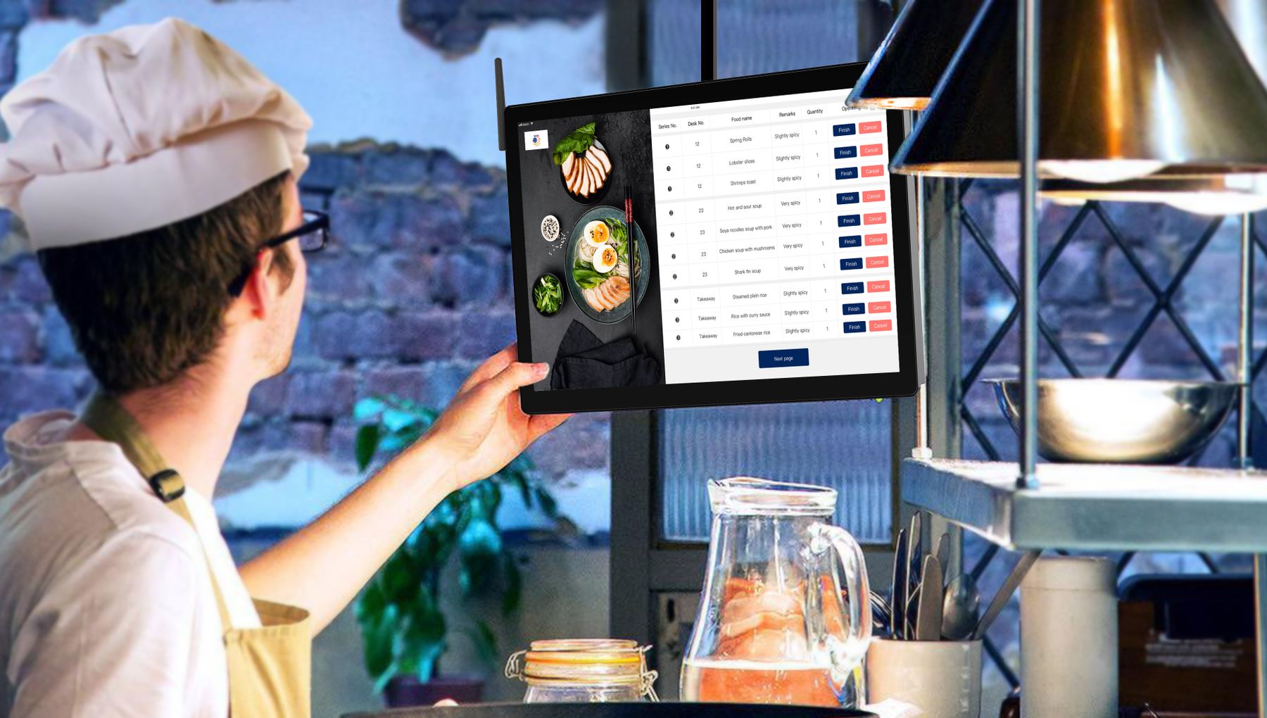 Chef using a digital menu display in a restaurant kitchen